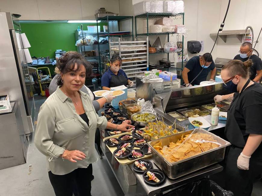 Leticia Mitchell checks on the kitchen at the grand opening celebration for Letty's de Leticia' ...