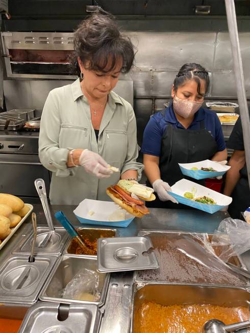 Leticia Mitchell assembles a torta at the grand opening celebration for Letty's de Leticia's Co ...