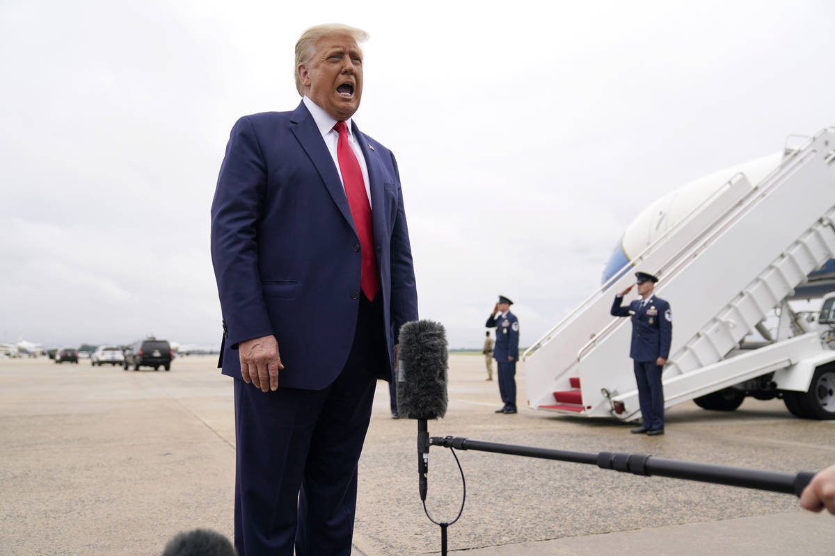 President Donald Trump speaks to the media before boarding Air Force One for a trip to Kenosha, ...