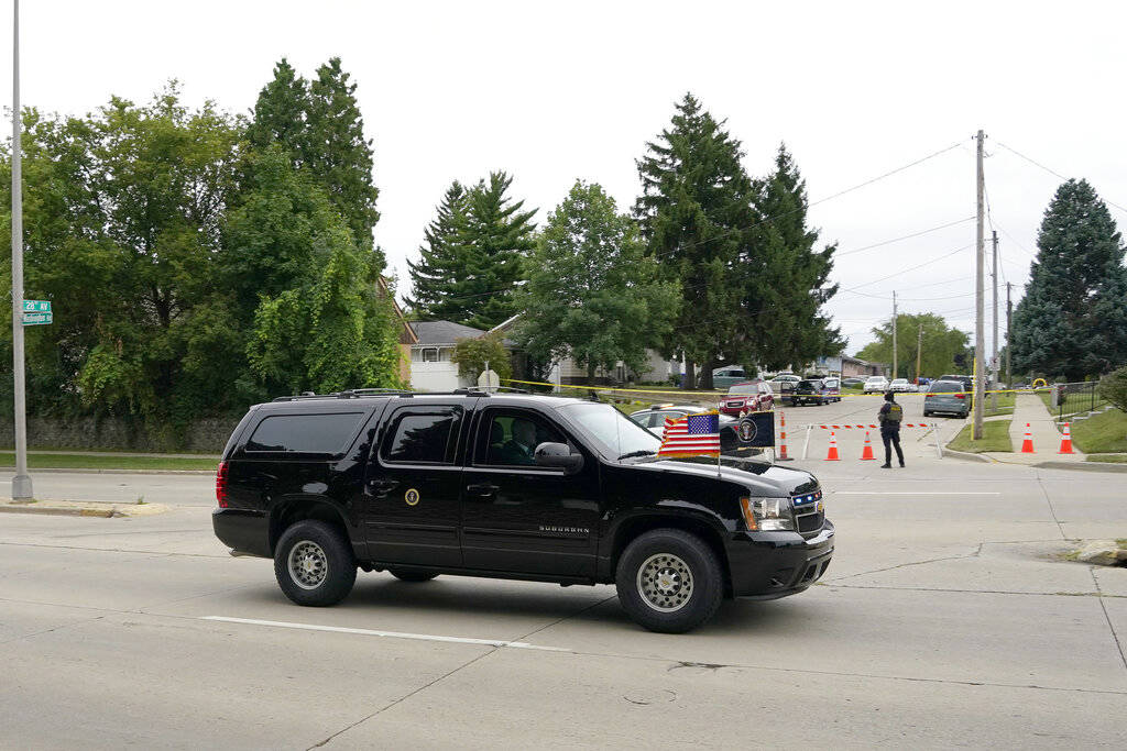 President Donald Trump's caravan passes the street where Jacob Blake was shot Tuesday, Sept. 1, ...