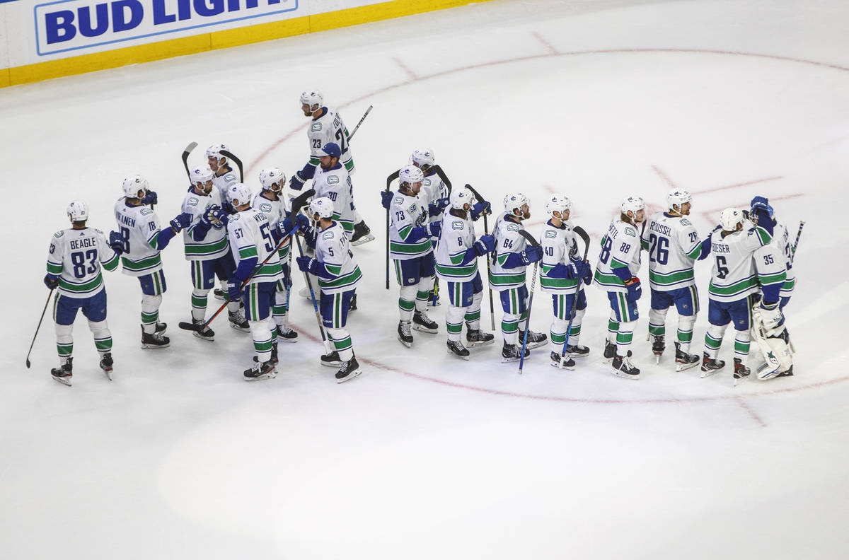 Vancouver Canucks celebrate a win over the Vegas Golden Knights during Game 5 of an NHL hockey ...