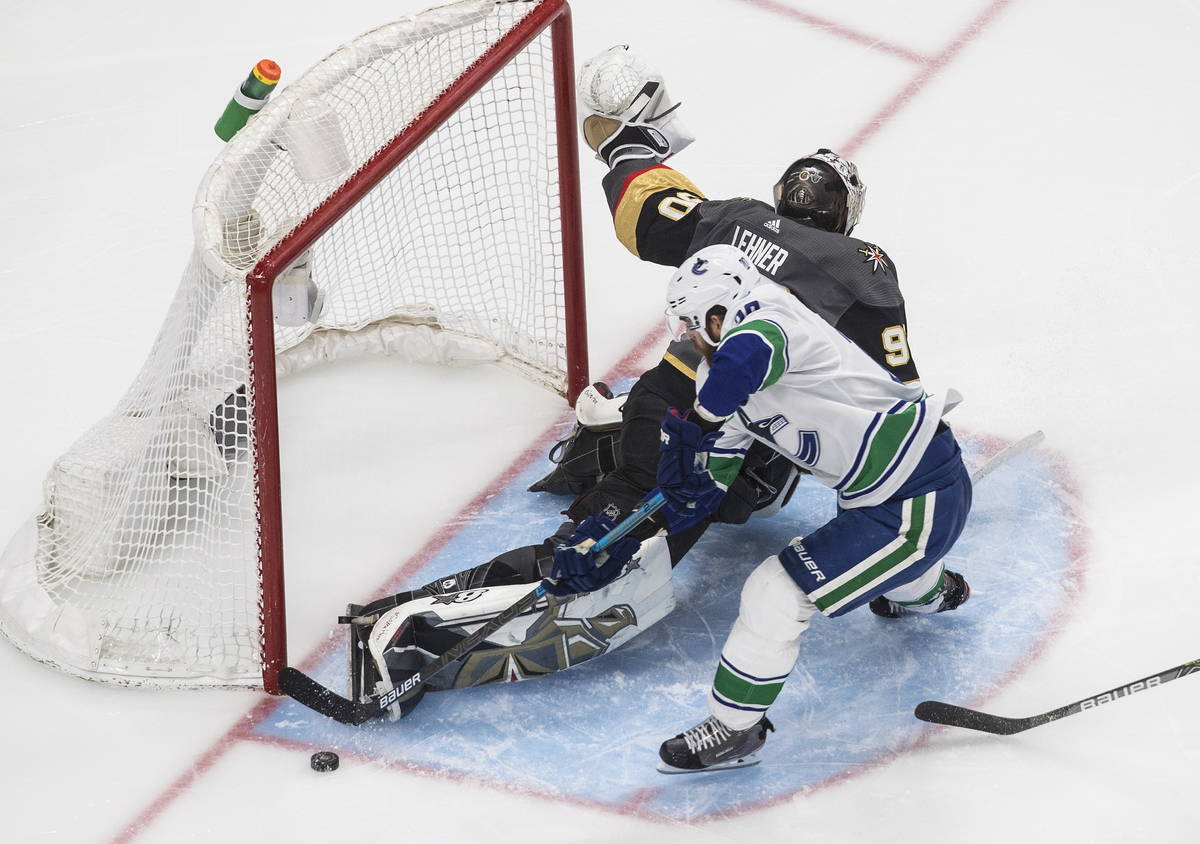 Vancouver Canucks' Brandon Sutter (20) is stopped by Vegas Golden Knights goalie Robin Lehner ( ...
