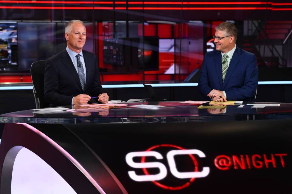Kenny Mayne sits on the set of SportsCenter with co-anchor John Anderson. He has been at ESPN s ...