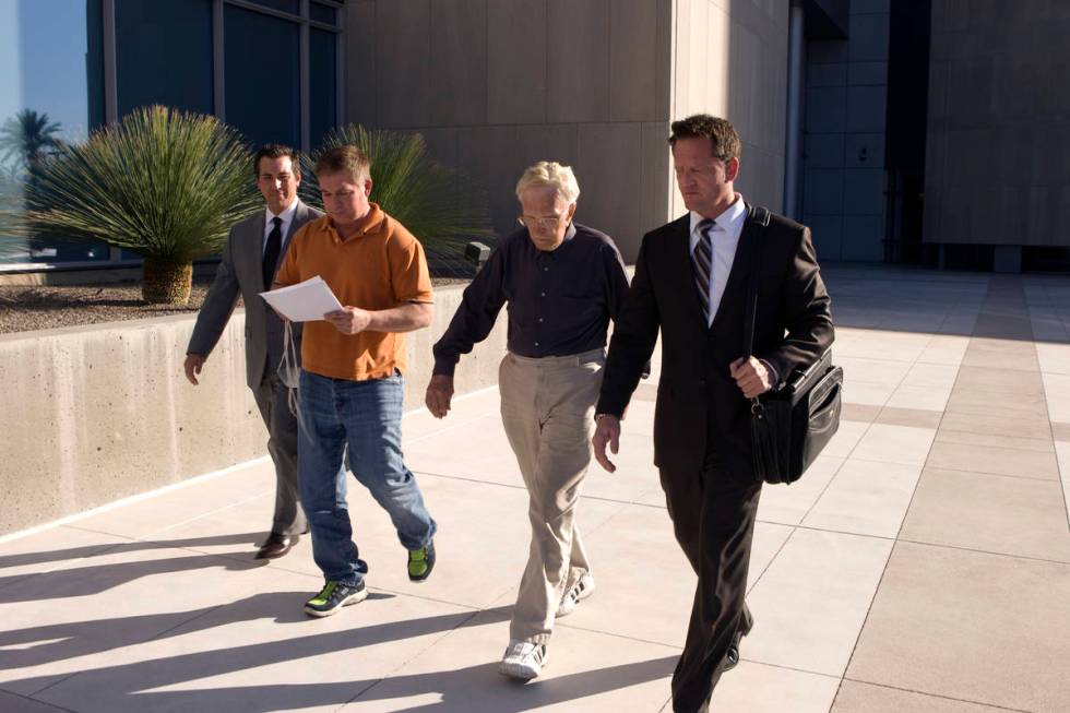 Dr. Henri Wetselaar, second from right, leaves the Lloyd George U.S. Courthouse in September 20 ...