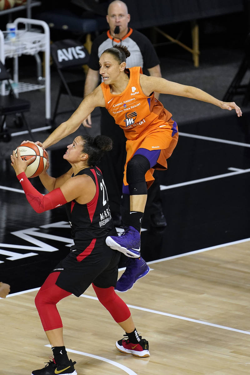 Phoenix Mercury guard Diana Taurasi (3) goes airborne in an attempt to block a shot by Las Vega ...