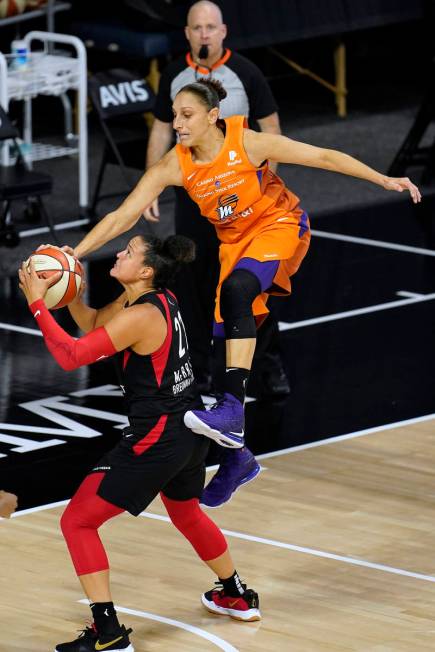 Phoenix Mercury guard Diana Taurasi (3) goes airborne in an attempt to block a shot by Las Vega ...