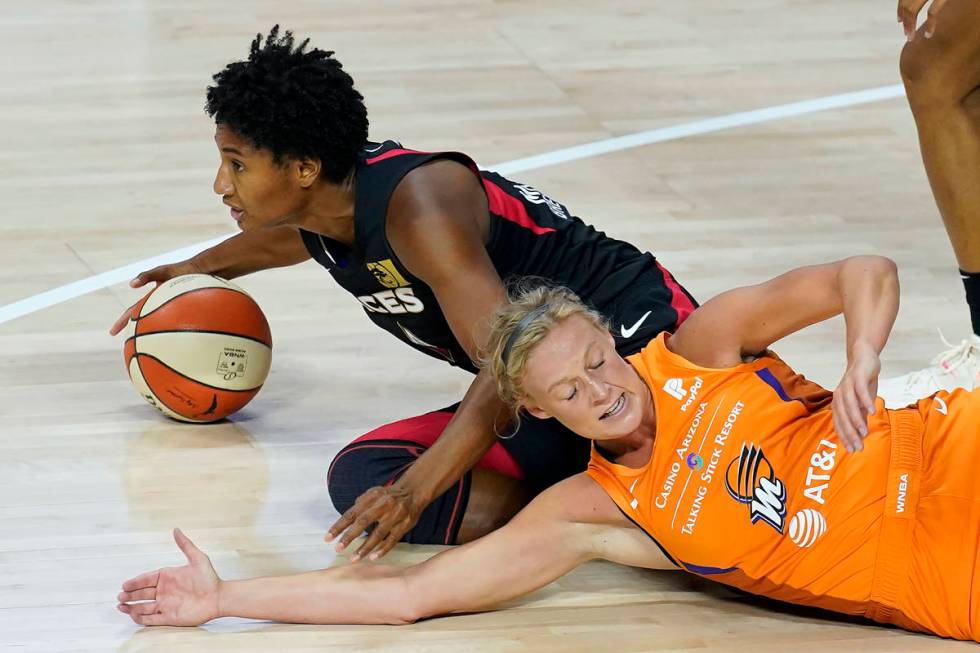 Las Vegas Aces forward Angel McCoughtry (35) beats Phoenix Mercury guard Sophie Cunningham (9) ...