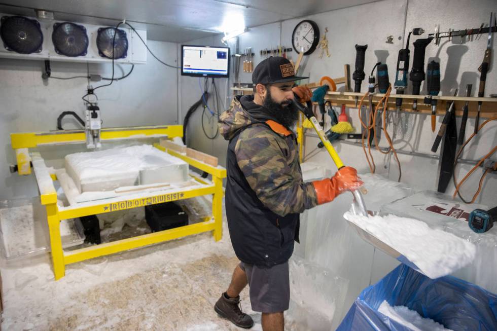 Marco Villarreal, known as "Vegas Ice Man," shovels freshly made snow on Tuesday, Sep ...