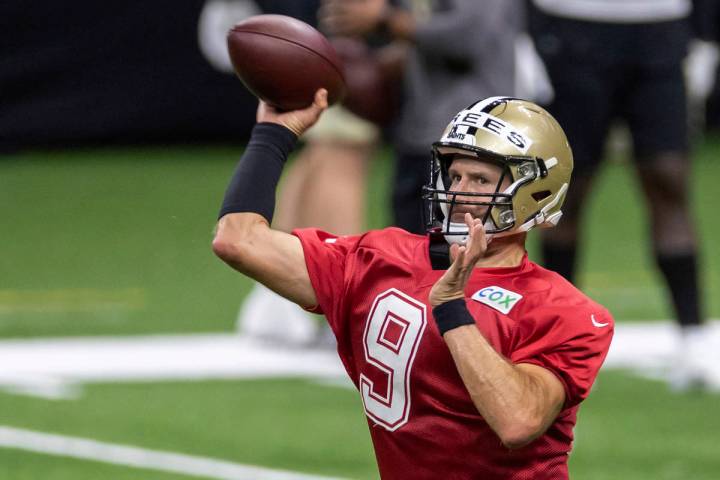 New Orleans Saints quarterback Drew Brees throws the ball during NFL football training camp Sat ...