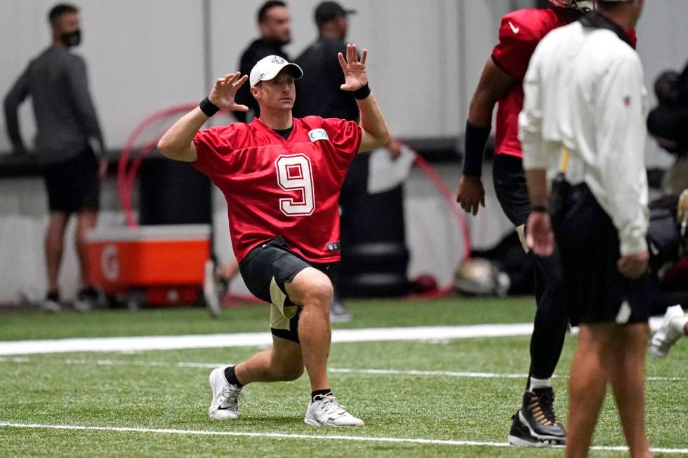 New Orleans Saints quarterback Drew Brees (9) stretches during practice at their NFL football t ...