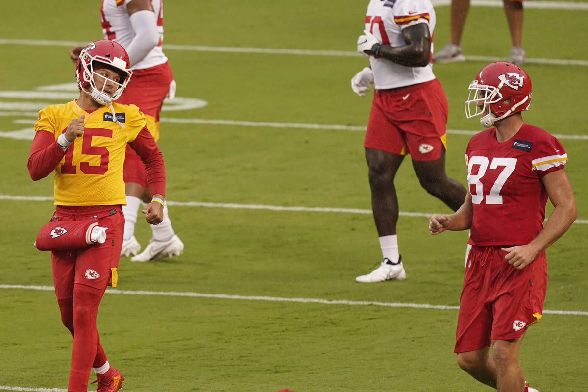 Kansas City Chiefs quarterback Patrick Mahomes (15) and tight end Travis Kelce (87) run during ...