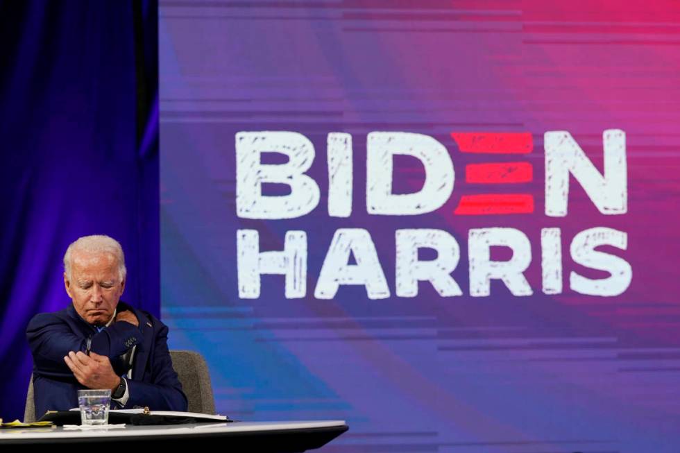 Democratic presidential candidate former Vice President Joe Biden receives a briefing from educ ...