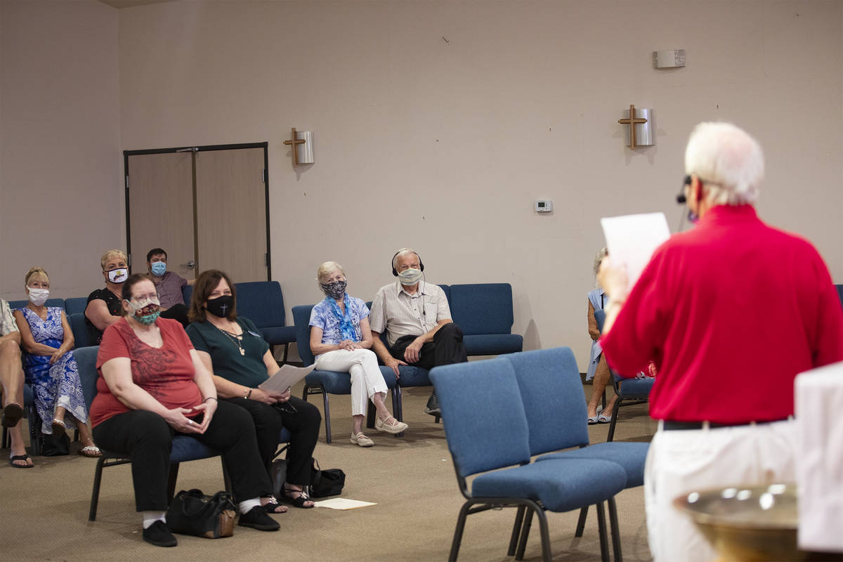 A small group of congregants listen to a sermon that's also being live-streamed from New Song C ...