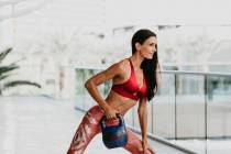 Lacy Schorr, Summerlin resident and fitness instructor at TruFusion, demonstrates her fitness t ...