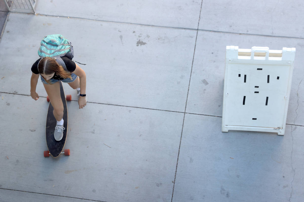 A person rides a skateboard to the Student Union at UNLV in Las Vegas, Friday, Sept. 4, 2020. ( ...