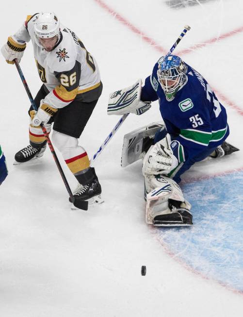 Vancouver Canucks goalie Thatcher Demko (35) stops Vegas Golden Knights' Paul Stastny (26) duri ...