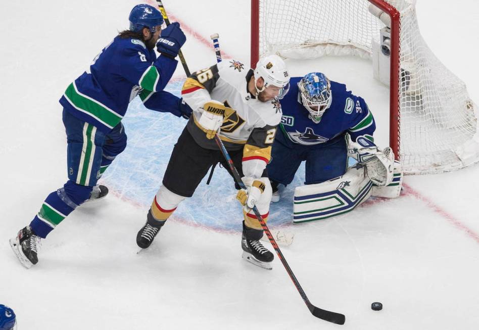 Vancouver Canucks goalie Thatcher Demko (35) makes a save on Vegas Golden Knights' Paul Stastny ...