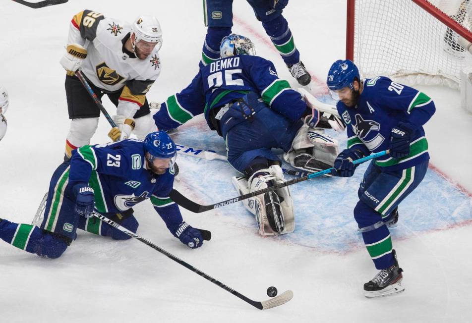 Vancouver Canucks goalie Thatcher Demko (35) makes a save on Vegas Golden Knights' Paul Stastny ...