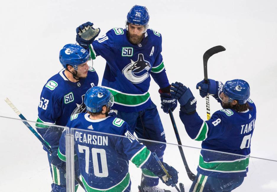 Vancouver Canucks' Bo Horvat (53), Brandon Sutter (20), Tanner Pearson (70) and Christopher Tan ...