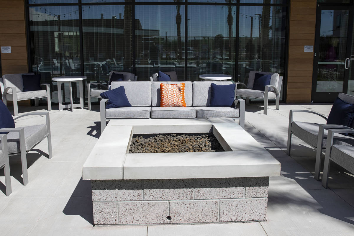 Rest area with fire pit at a newly built, dual branded Hampton Inn & Suites and Home2 Suite ...