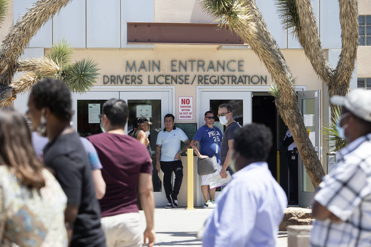 People wait in line at the Nevada Department of Motor Vehicles at 8250 West Flamingo Road, whic ...