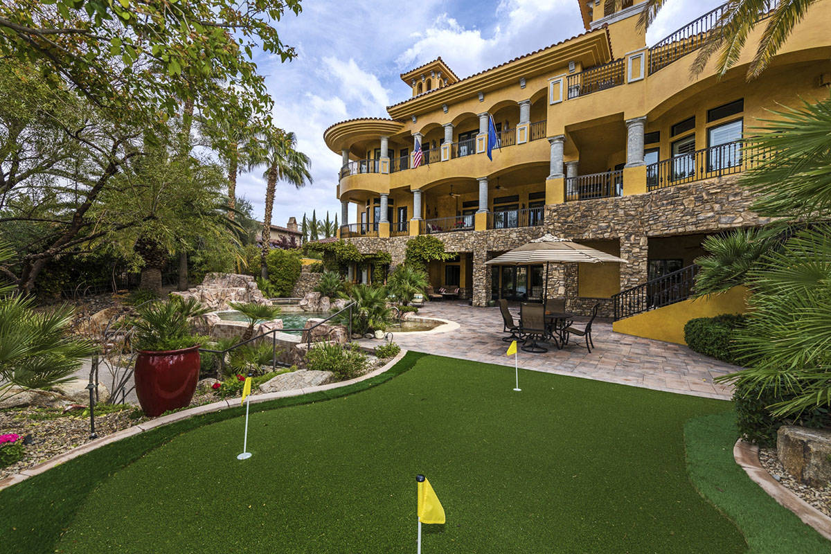 The Lake Las Vegas home has a putting green. It also sits on the lake and the golf course. (Eli ...