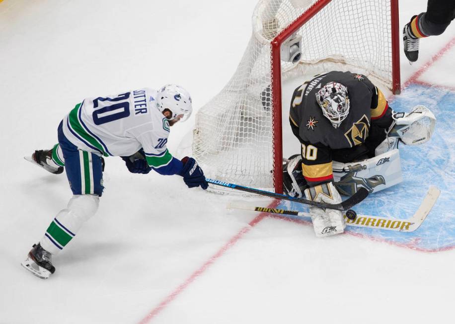 Vancouver Canucks' Brandon Sutter (20) is stopped by Vegas Golden Knights goalie Robin Lehner ( ...