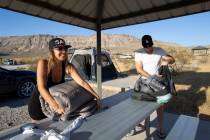 Elisa Bernal and Robert Reich, of Los Angeles, pack their campsite at Red Rock Canyon Campgroun ...