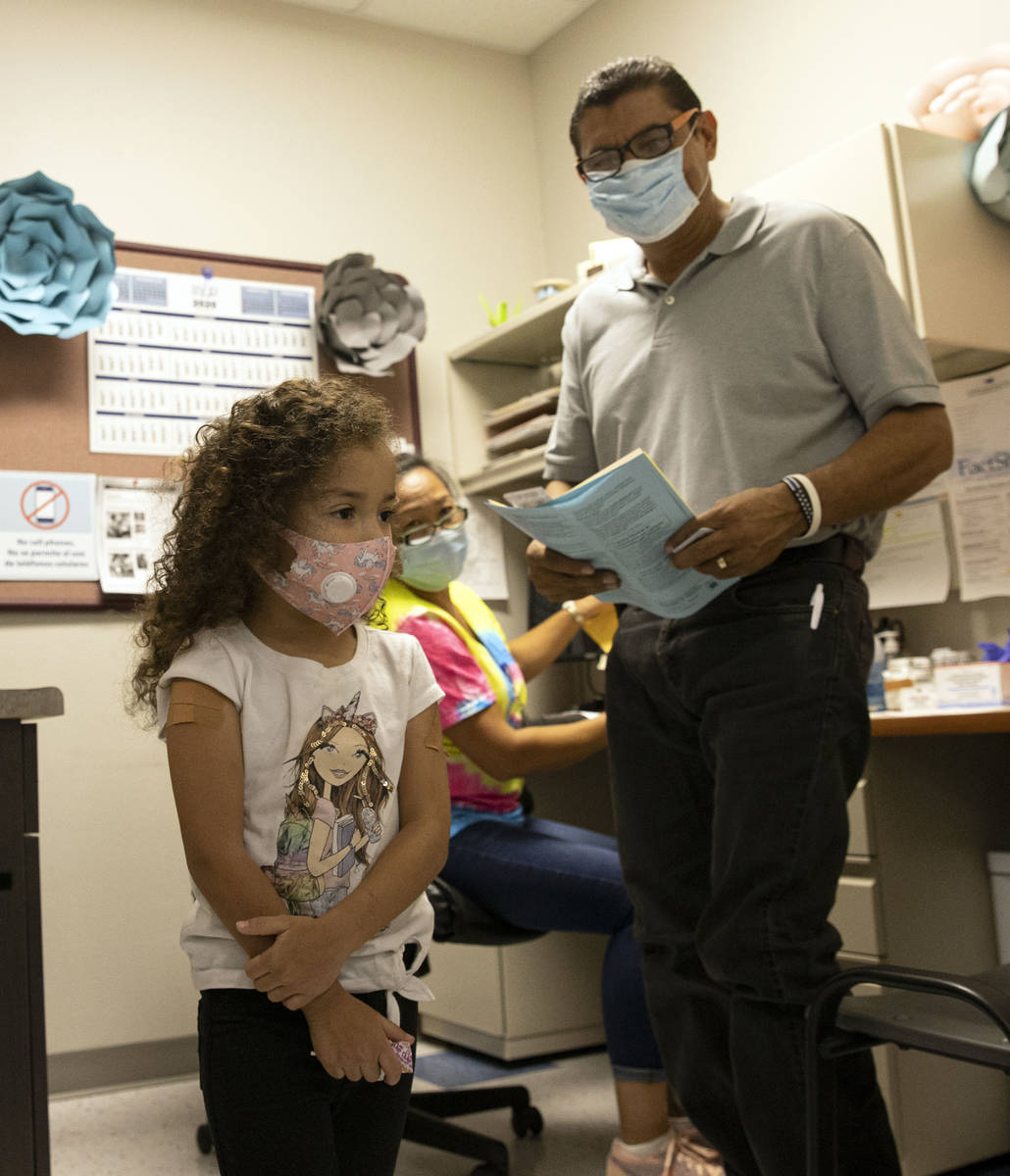 Jasmin Moreno, 4, leaves the room with her father Roberto Lopez after getting vaccinated as Vic ...