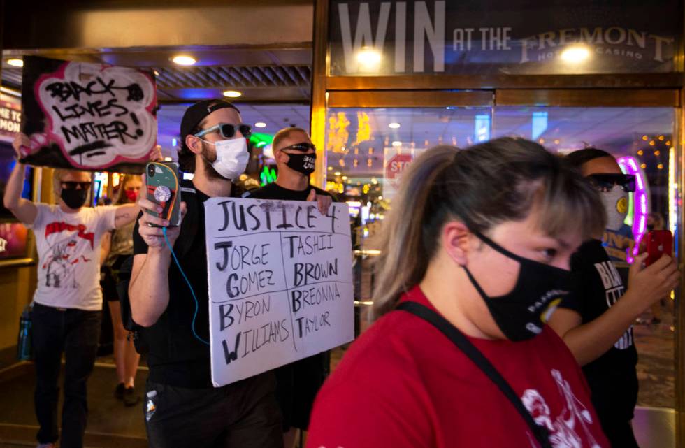 Protesters in the "Justice For Breonna Taylor and the Las Vegas Victims of Police Terroris ...