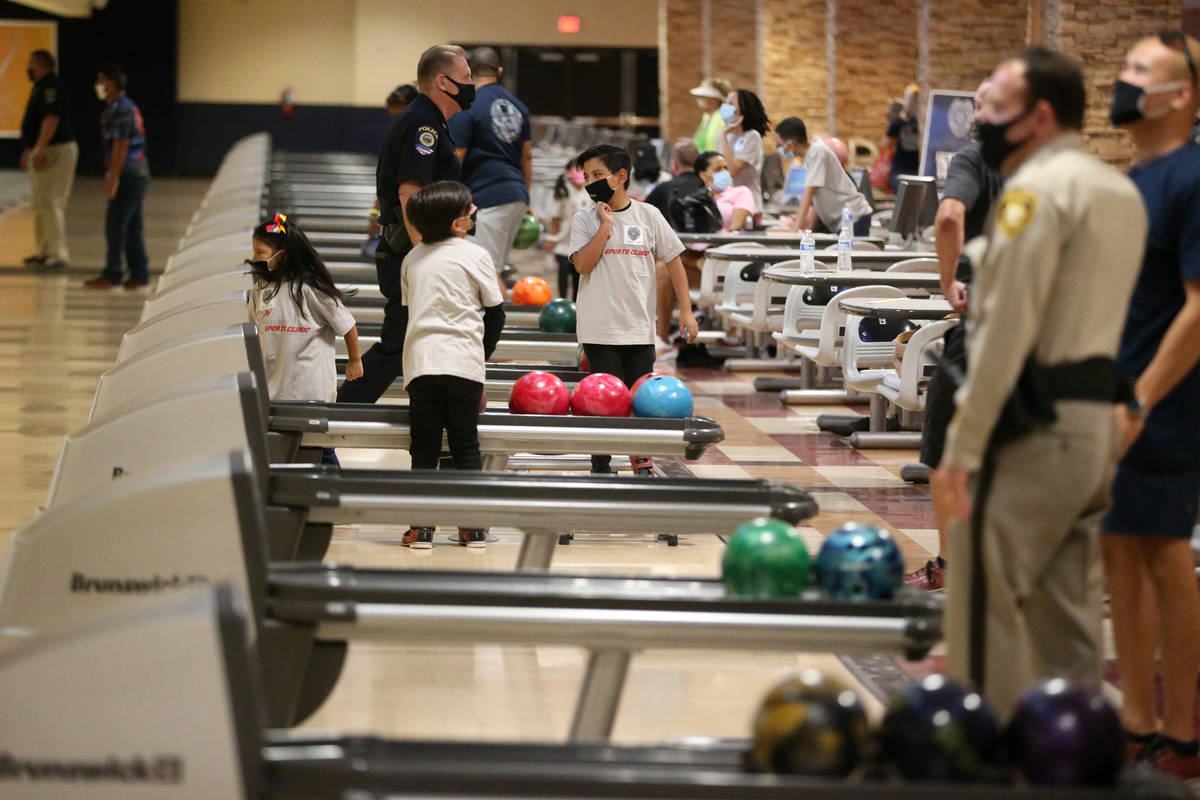 People participate during the Angel Tree Sports Clinic Bowling with Blue event at Santa Fe Stat ...