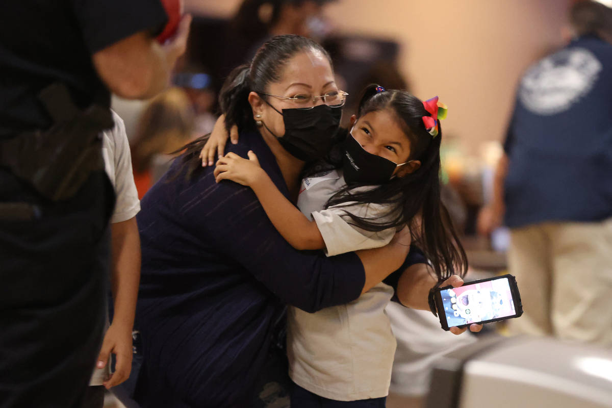 Cristiany Camila Hernandez, 8, hugs her grandmother Sabrina Garcia after bowling during the Ang ...