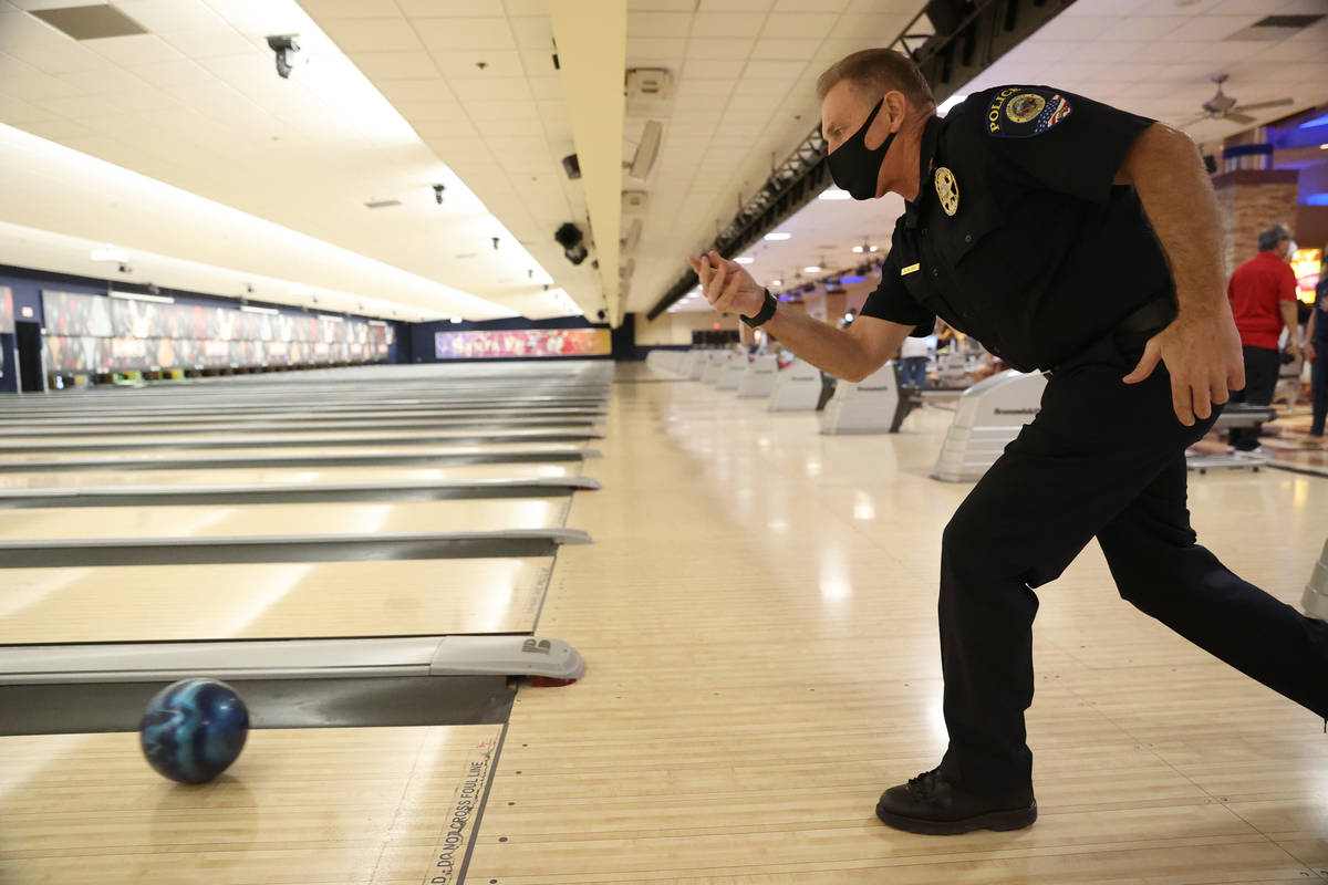 Robert Mayer, detective with the Clark County School District Police Department, bowls during t ...