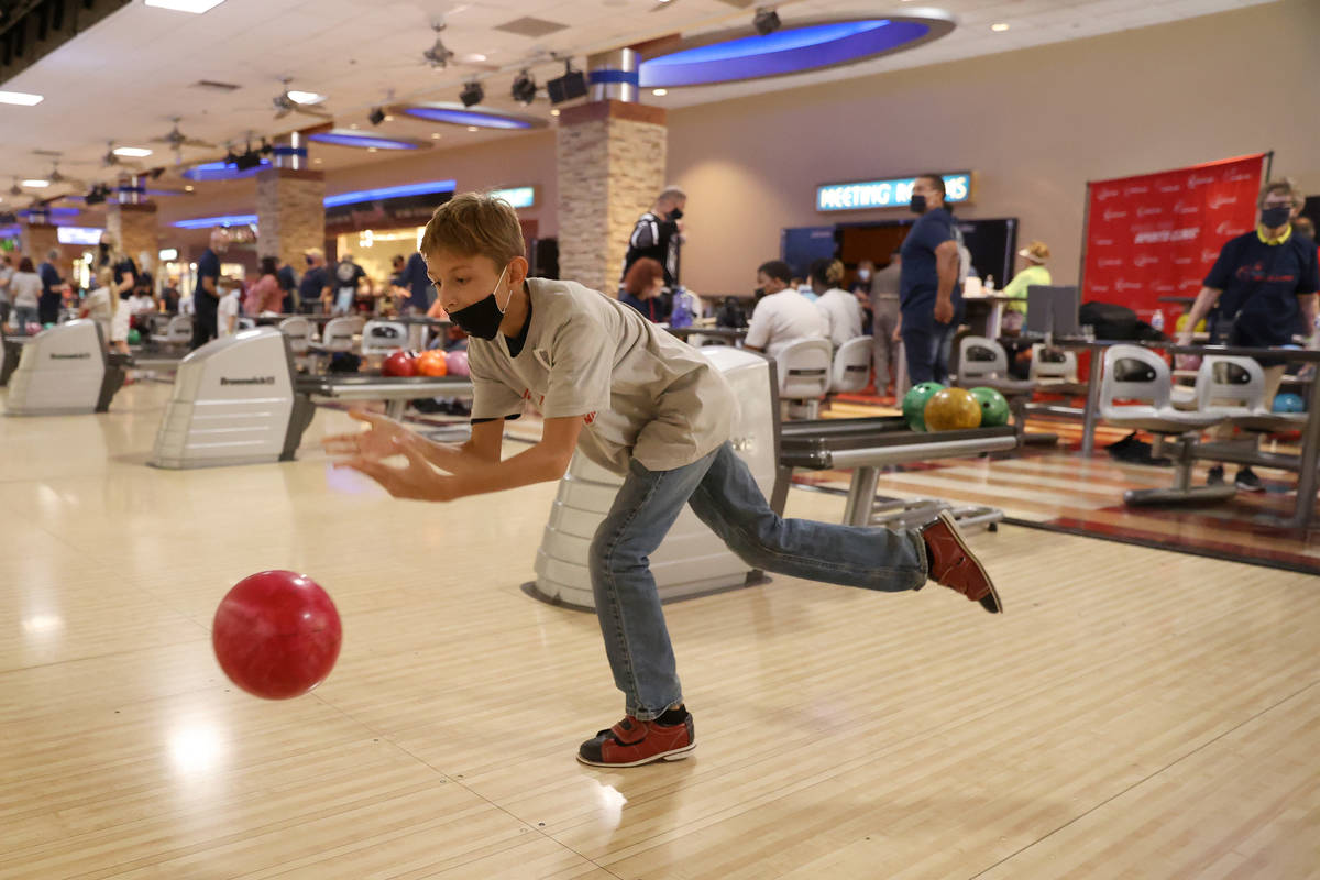 Kenny Tibbs, 10, bowls during the Angel Tree Sports Clinic Bowling with Blue event at Santa Fe ...