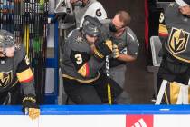 Vegas Golden Knights' Brayden McNabb (3) receives treatment at the bench during the second peri ...