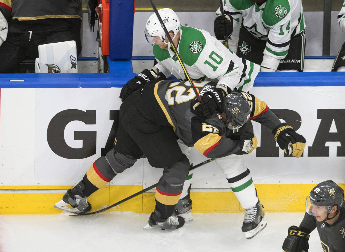 Vegas Golden Knights' Paul Stastny (26) checks Dallas Stars' Corey Perry (10) during the first ...