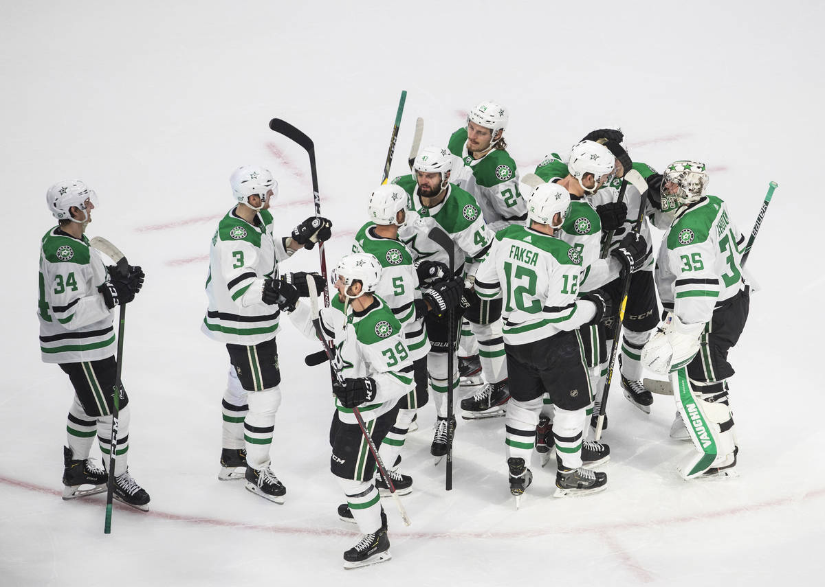 Dallas Stars players celebrate their 1-0 win over the Vegas Golden Knights after an NHL Western ...