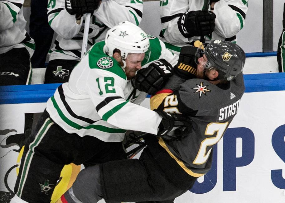 Vegas Golden Knights' Paul Stastny (26) is checked by Dallas Stars' Radek Faksa (12) during the ...
