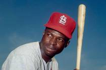 FILE - In this April 9, 1965, file photo, Lou Brock, of the St. Louis Cardinals, poses in Misso ...