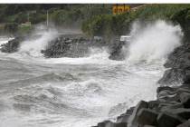 High waves pound the coast of the Kagoshima city in the southwestern island of Kyushu, Japan. T ...