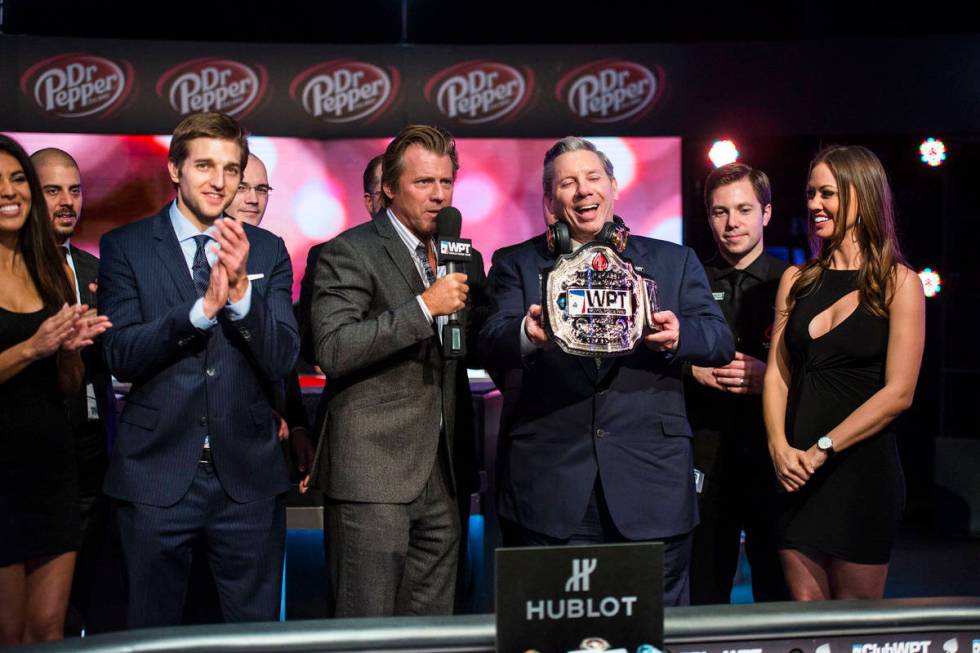 Mike Sexton receives his champion's belt after winning a World Poker Tour event in Montreal in ...