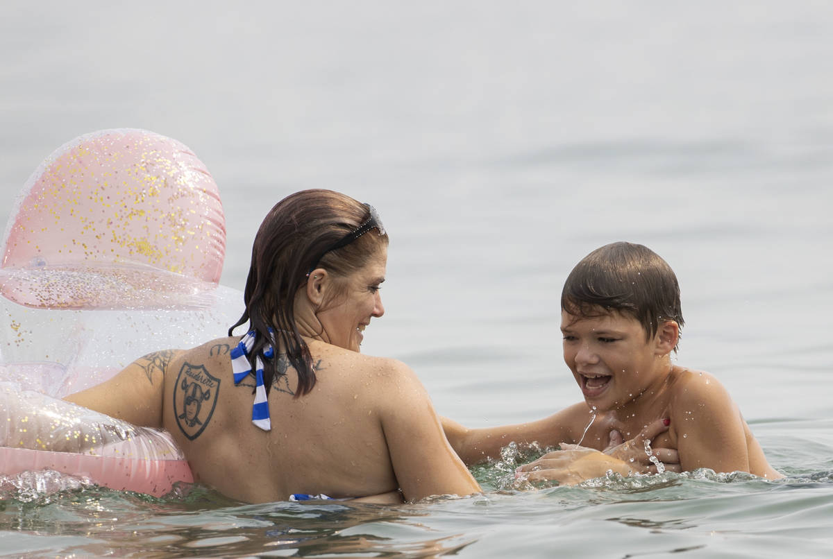 Stephanie Murphy plays with her son Aiden, 9, Both of Las Vegas, at Boulder beach in the Lake M ...
