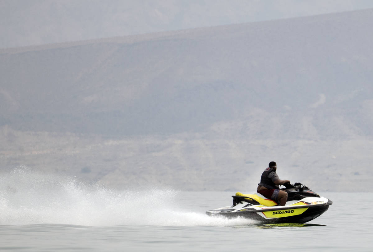 A man rides his jet ski at Boulder beach in the Lake Mead National Recreation Area on Monday, S ...