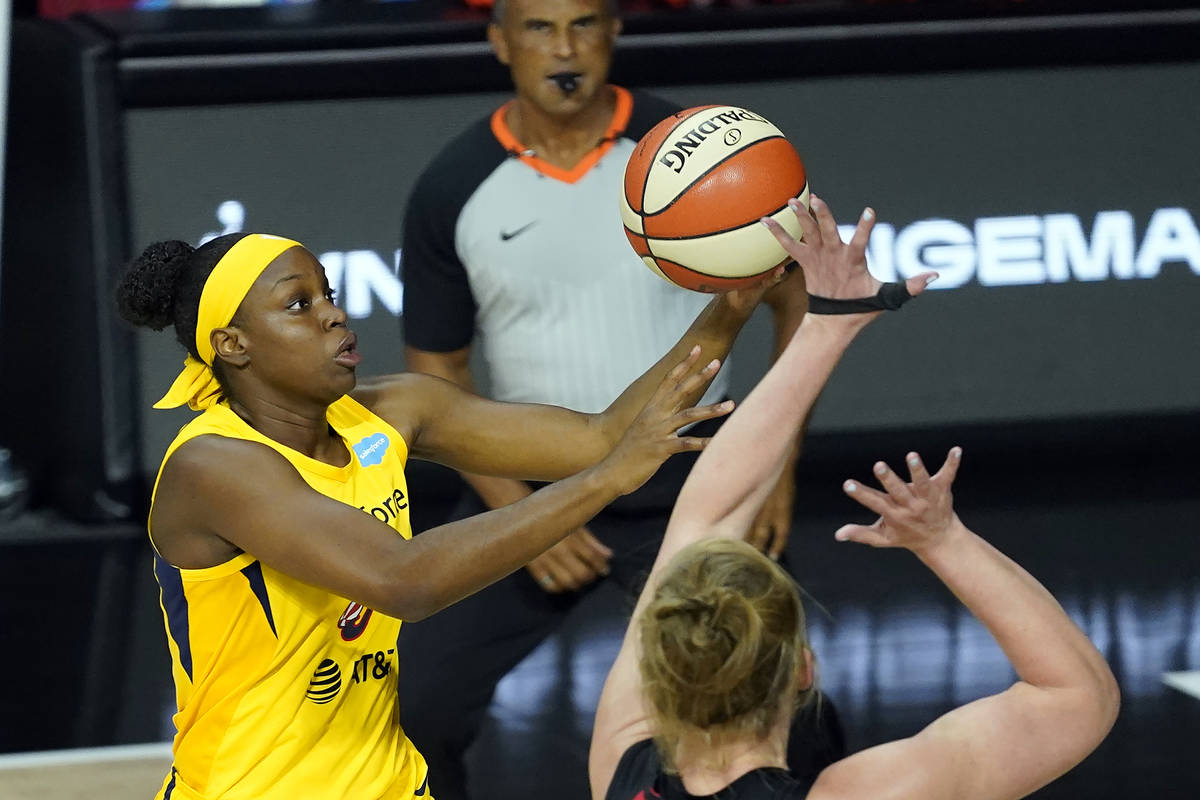 Indiana Fever forward Kennedy Burke (8) shoots over Las Vegas Aces center Carolyn Swords during ...