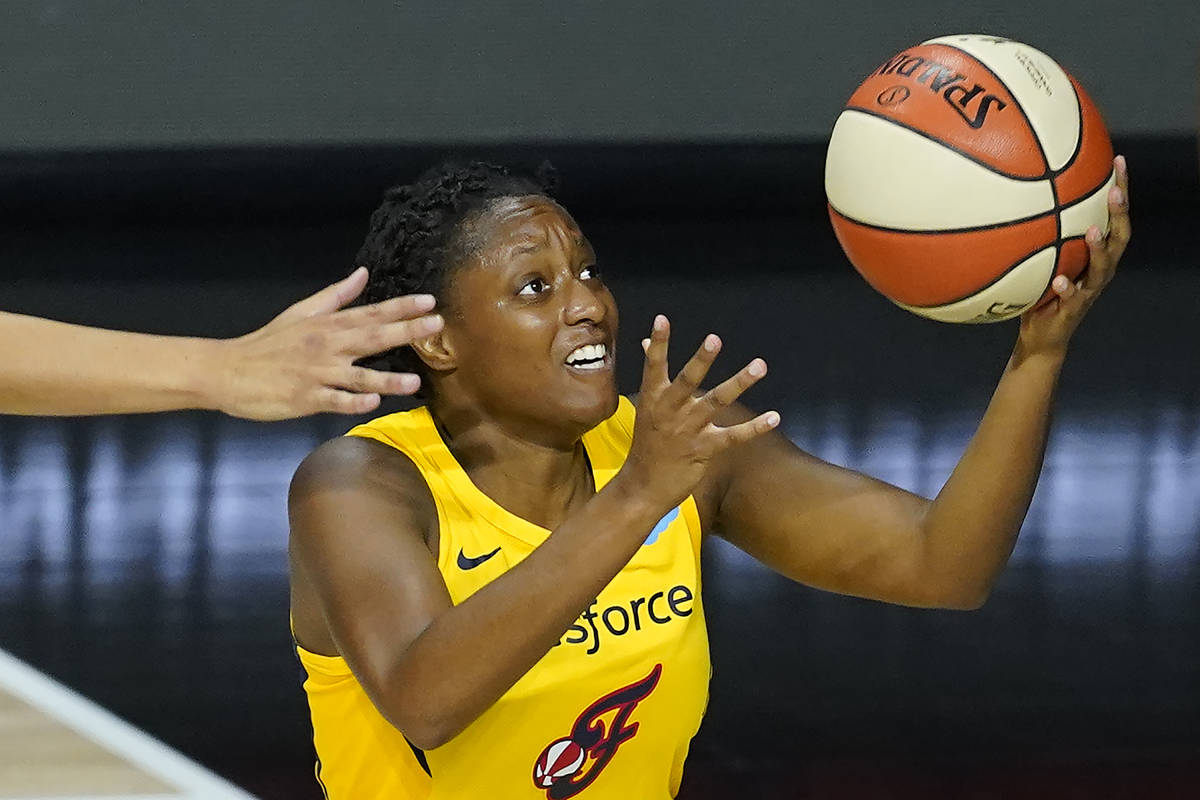 Indiana Fever guard Kelsey Mitchell goes up for a layup during the first half of a WNBA basketb ...
