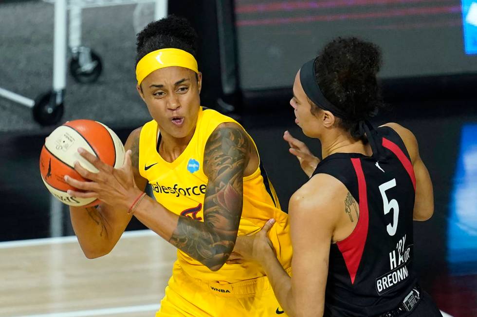 Indiana Fever forward Candice Dupree (4) works against Las Vegas Aces forward Dearica Hamby (5) ...