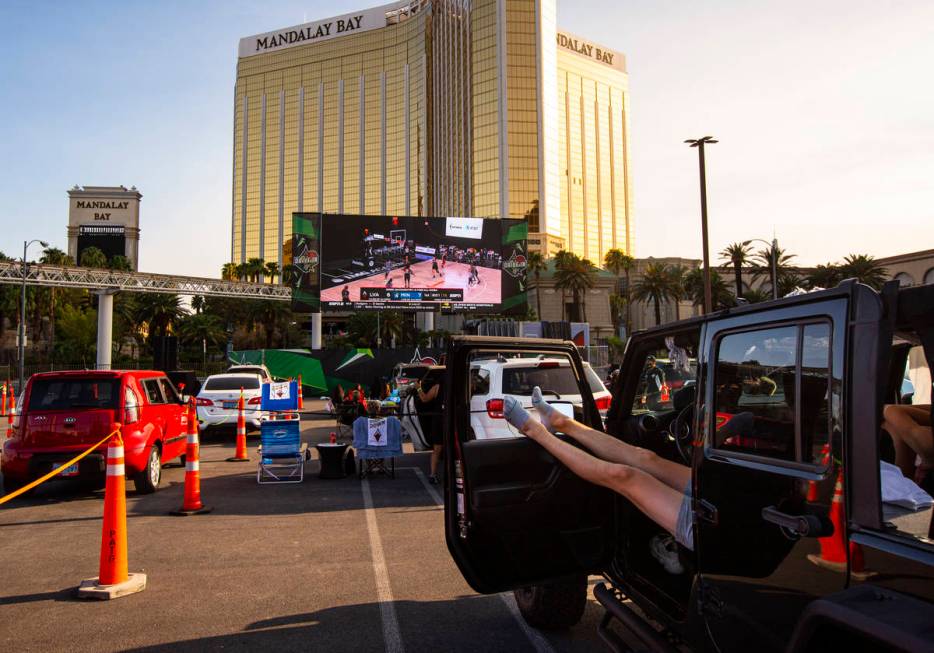 Las Vegas Aces fans watch a drive-in showing of the Las Vegas Aces WNBA game against the Minnes ...