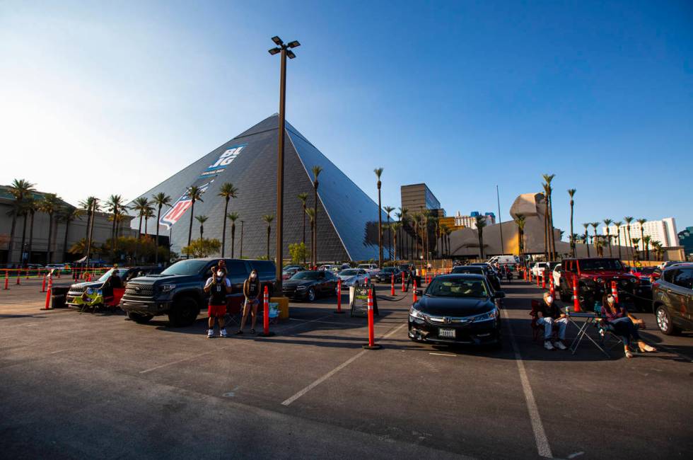 Las Vegas Aces fans cheer at the start of a drive-in showing of the Las Vegas Aces WNBA game ag ...