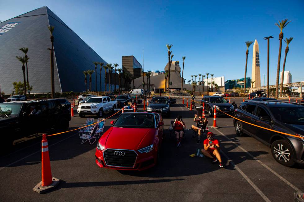 Las Vegas Aces fans cheer during a drive-in showing of the Las Vegas Aces WNBA game against the ...