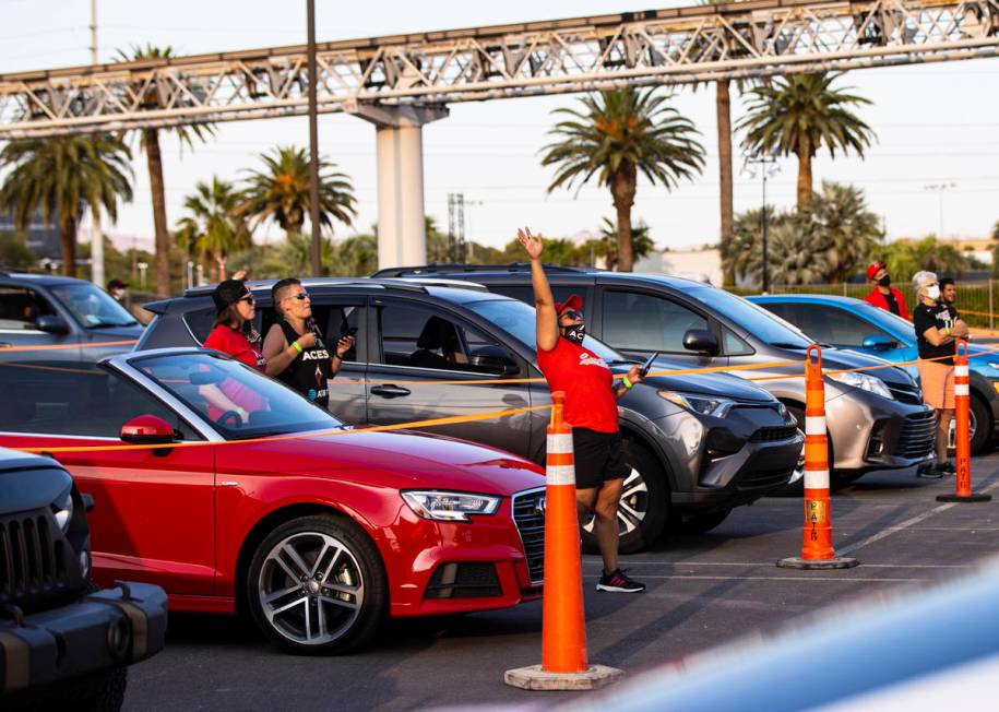 Las Vegas Aces fans cheer during a drive-in showing of the Las Vegas Aces WNBA game against the ...